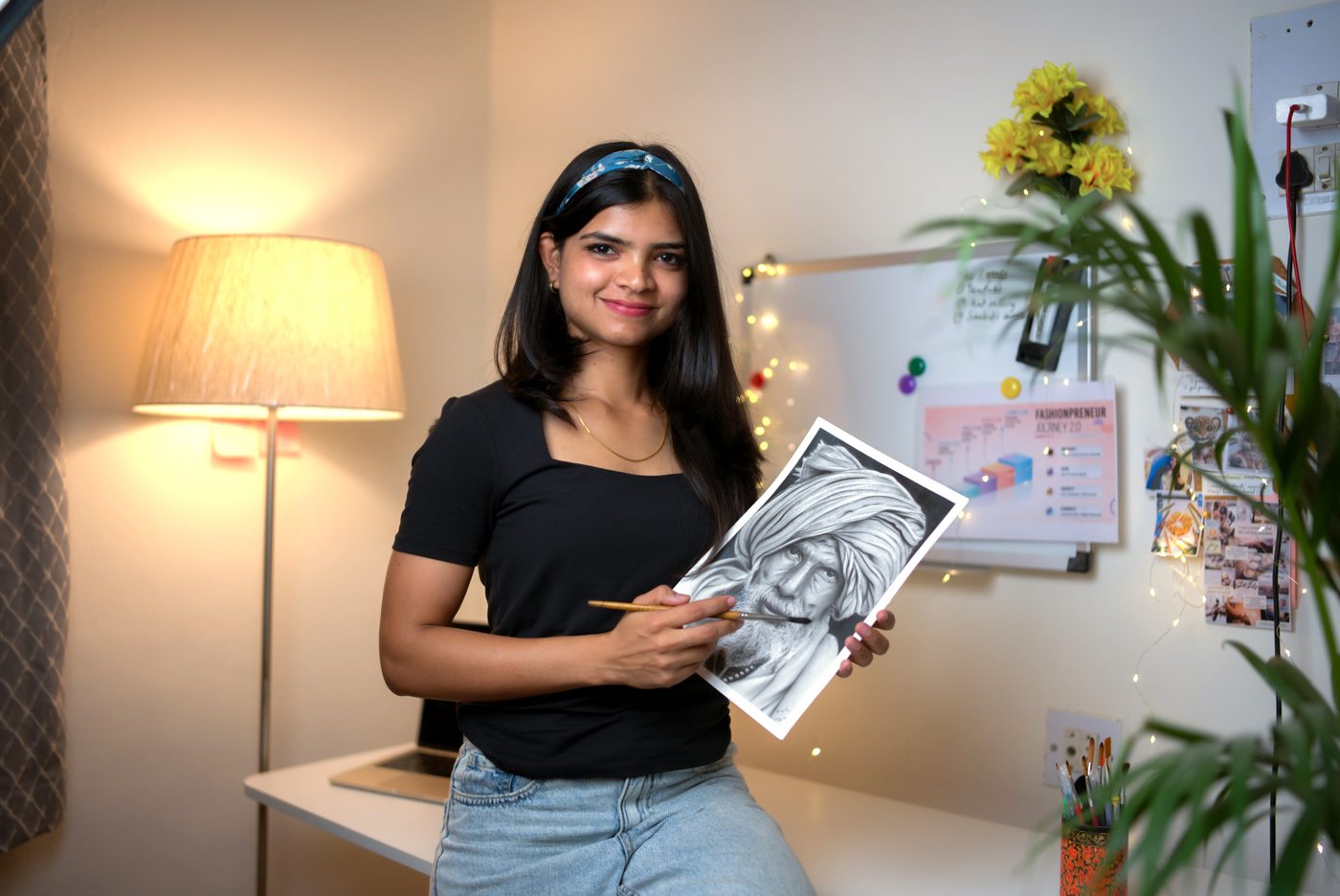 Vaishnavi Khandkar creating portrait art in her studio